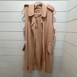 New with tag. Sleeveless Cardigan in a salmon color. Size medium